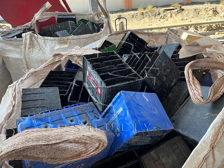 used plastic crates waiting to be crushed
